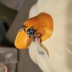 A silver and blue stone fish ring size 7